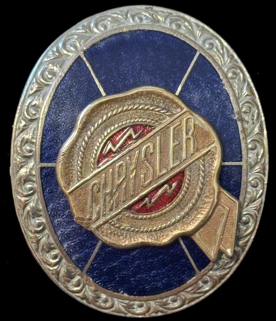 Chrysler Radiator Emblem: 1927 - 1928 Chrysler radiator emblem. This emblem has a Fox maker's mark on the seal and measures 2.2" high by 1.6" wide.