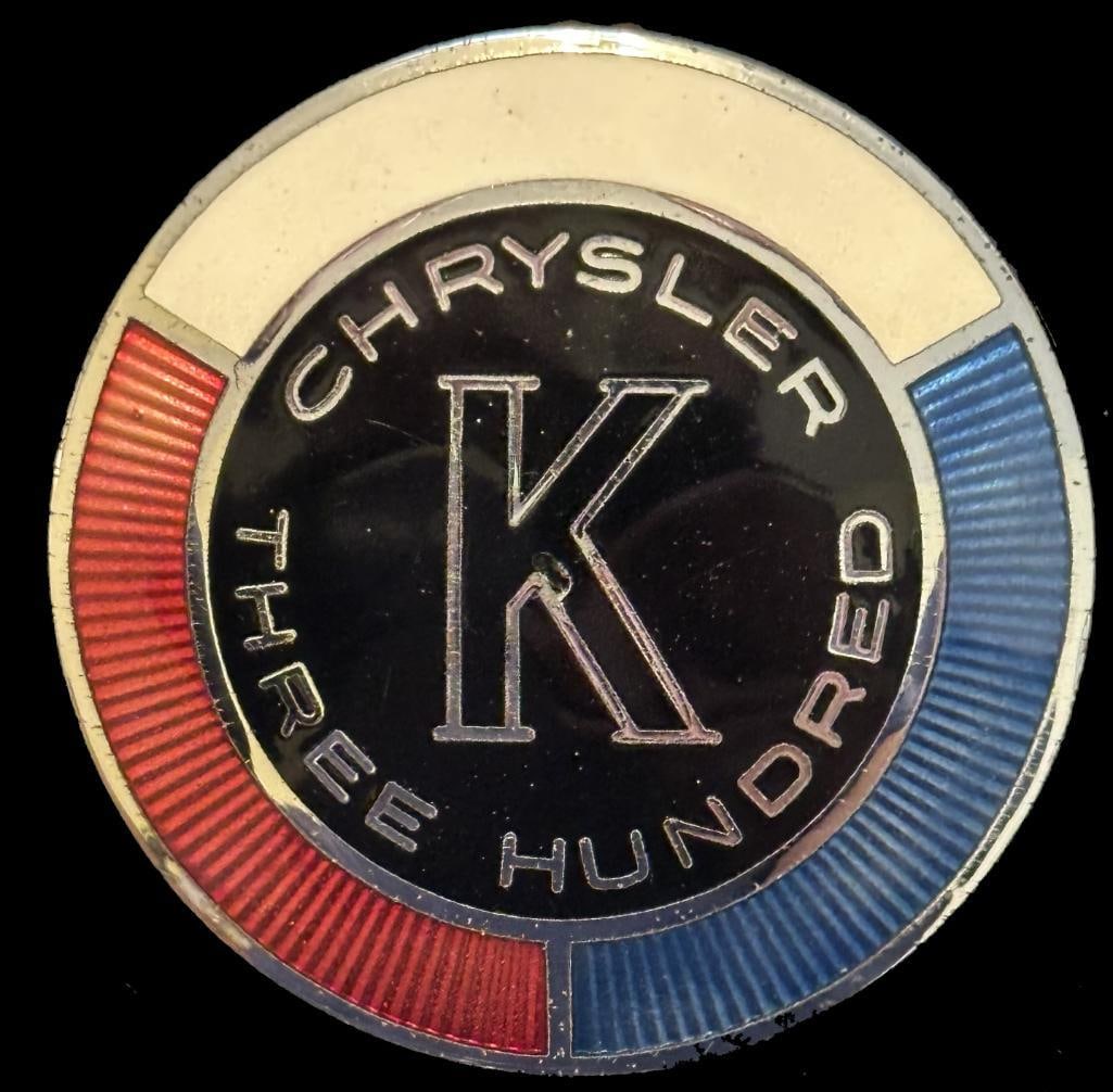 Chrysler Three Hundred K Emblem: 1964 Chrysler Three Hundred K emblem. This emblem has a Bastian Bros. maker's mark and measures approximately 2.5" in diameter.