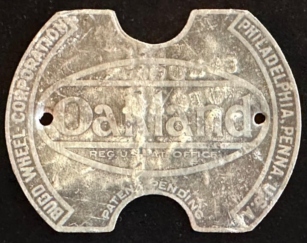 Oakland Wheel Emblem: Oakland wheel emblem. This emblem measures approximately 3" wide by 2.25" high.