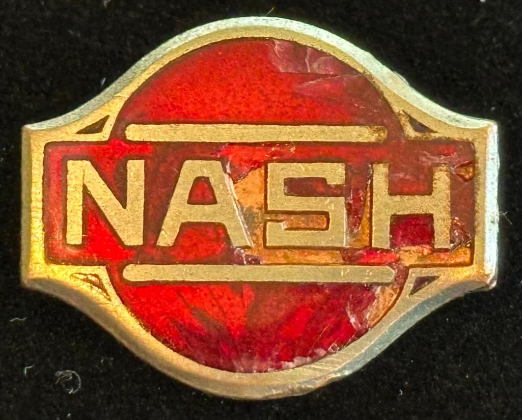 Nash Instrument Panel Emblem: 1928 Nash instrument panel emblem. This emblem measures approximately 1" wide by .75" high.