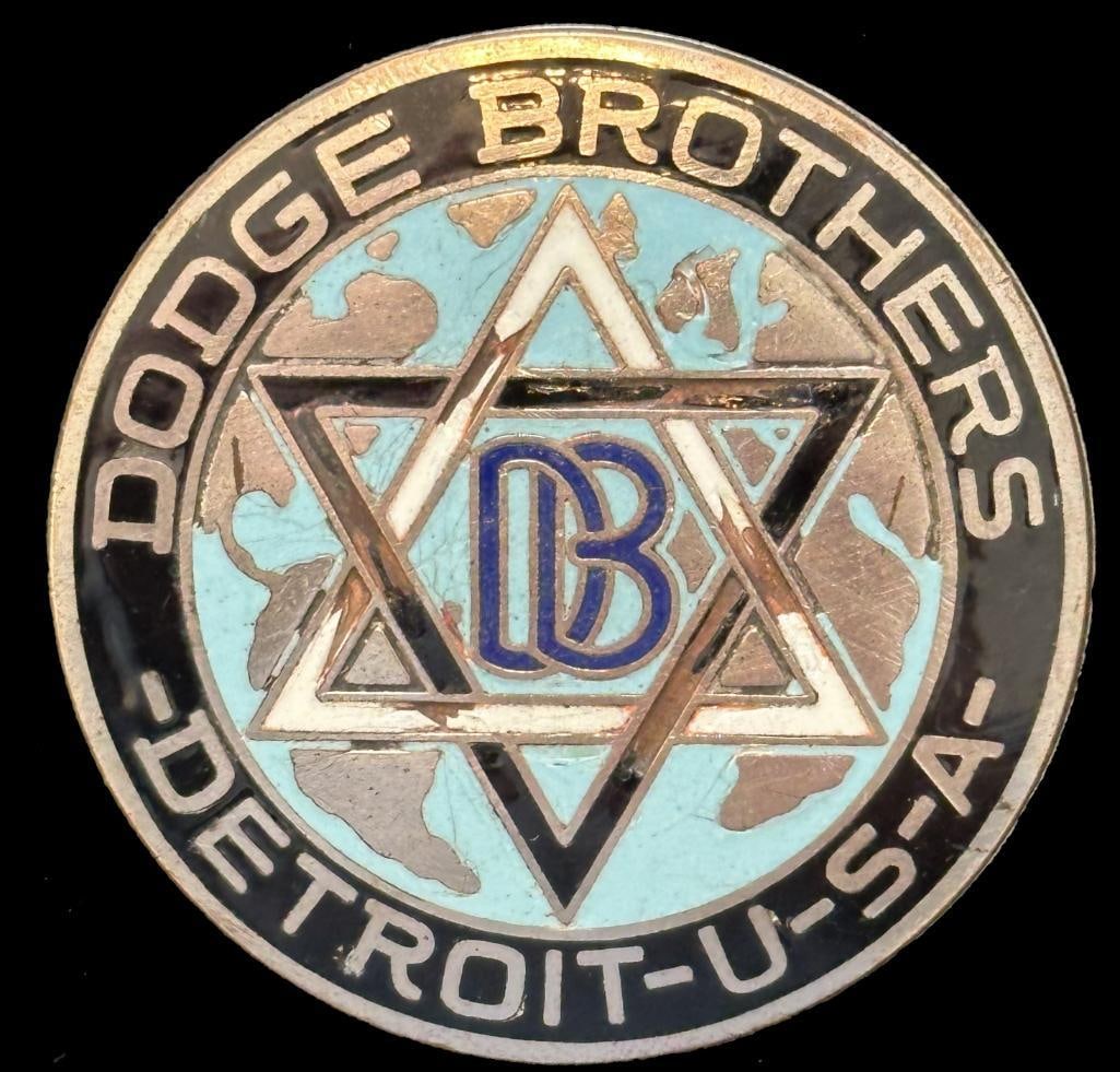 Dodge Brothers Radiator Emblem: 1914 - 1916 Dodge Brothers radiator emblem. This emblem measures approximately 2.25" in diameter.