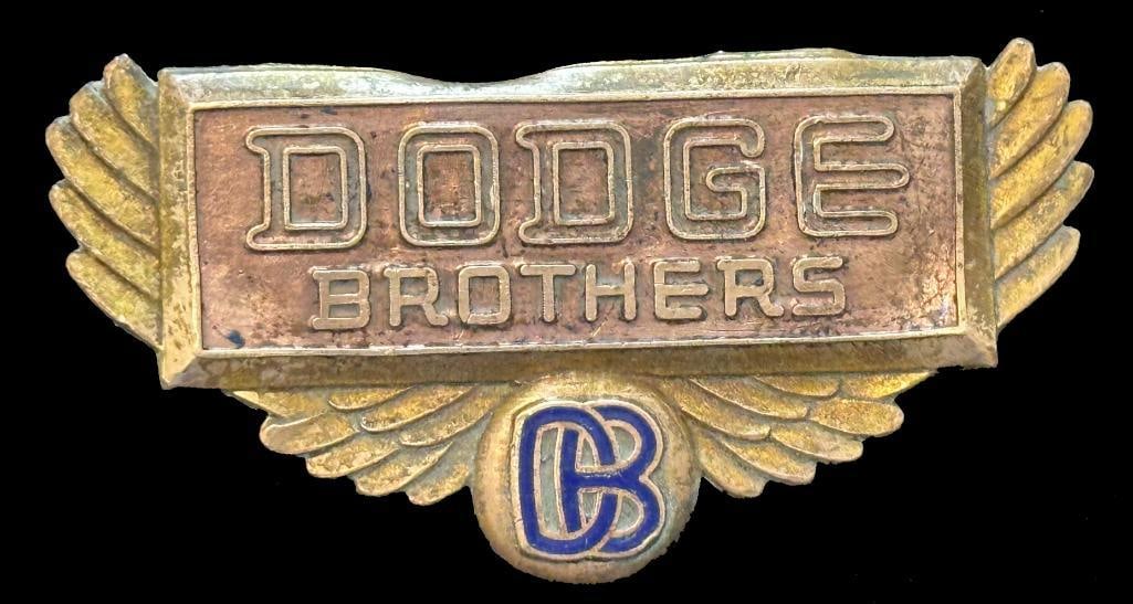 Dodge Brothers Radiator Emblem: 1929 - 1930 Dodge Brothers radiator emblem. This emblem has a Fox maker's mark. It is rated scarce and measures approximately 3.5" wide by 1.75" high.
