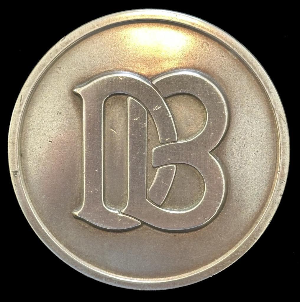 Dodge Brothers Spare Wheel Carrier Emblem: 1925 - 1928 Dodge Brothers spare wheel carrier emblem. The emblem measures 2.25" in diameter.