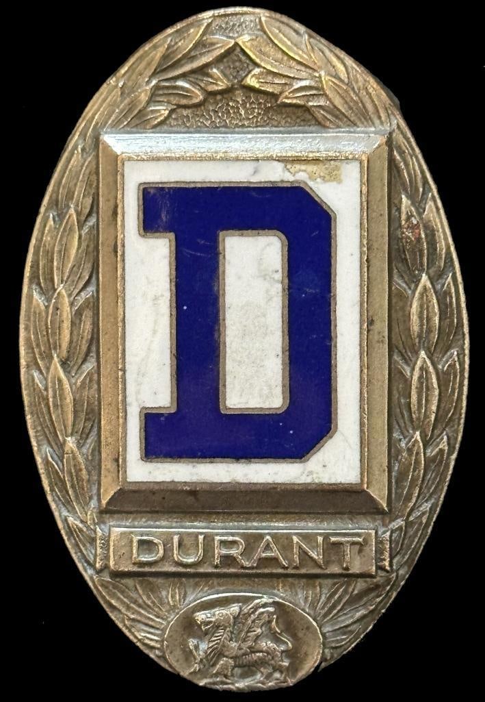 Durant Radiator Emblem: 1928 Durant radiator emblem (white background). This emblem measures approximately 2.25" high by 1.5" wide.