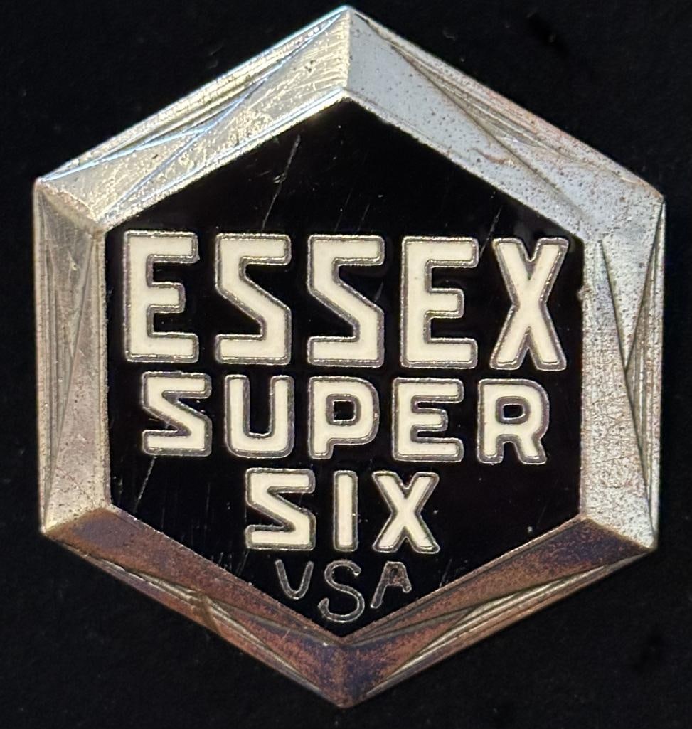 Essex Radiator Emblem: 1930 Essex radiator emblem. This emblem has a Fox maker's mark and measures approximately 2.25" high by 2" wide.