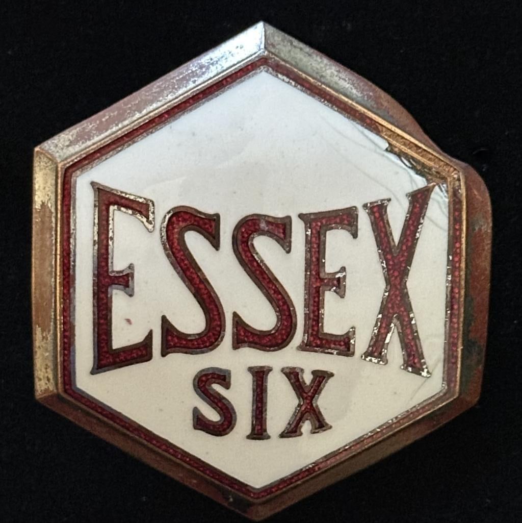 Essex Radiator Emblem: 1931 - 1932 Essex radiator emblem. This emblem has a Fox maker's mark and measures approximately 2" high by 1.75" wide.