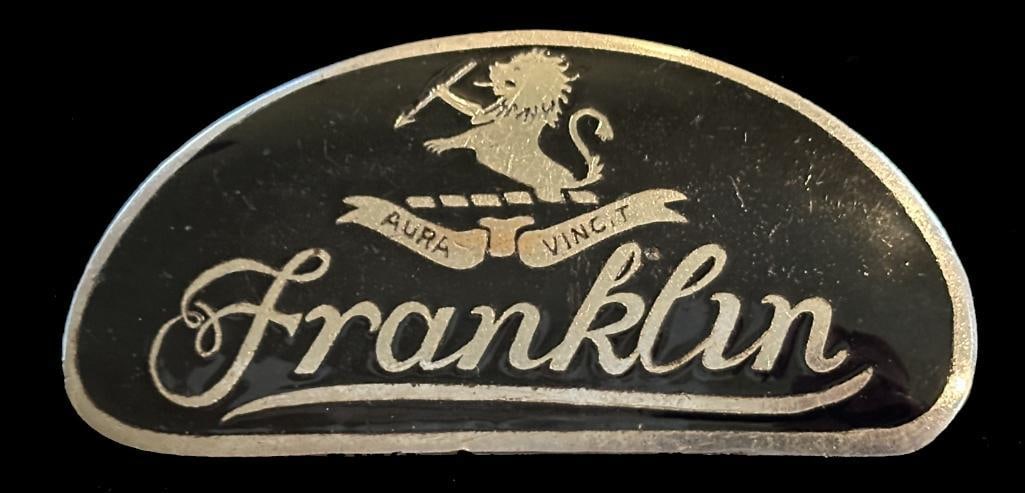 Franklin Radiator Emblem: 1923 - 1924 Franklin radiator emblem. This emblem is rated scarce and measures approximately 3.25" wide by 1.75" high.