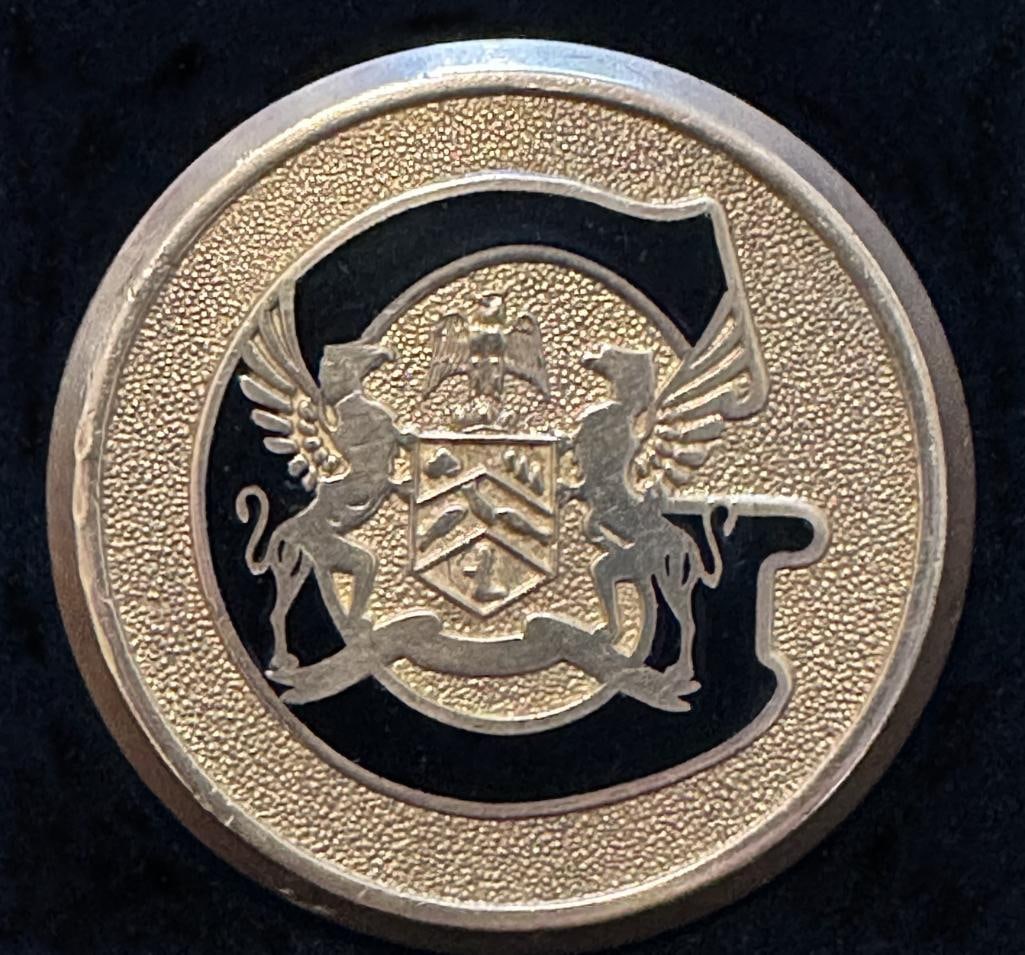 Gardner Radiator Emblem: 1927 - 1928 Gardner radiator emblem. This emblem has a DL Auld maker's mark in the attachment device and measures approximately 1.8" in diameter.