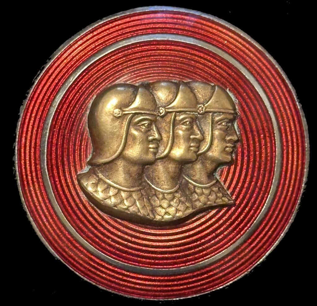 Graham Hood Ornament Emblem (Left side): 1937 Graham hood ornament emblem - left side. This emblem has a Fob maker's mark and measures approximately 2" in diameter.