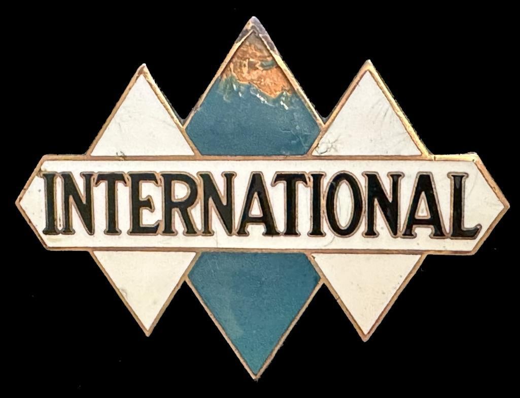 International Radiator Emblem: c1923 - 1933 International radiator emblem. This emblem measure approximately 3.5" wide by 2.6" high.