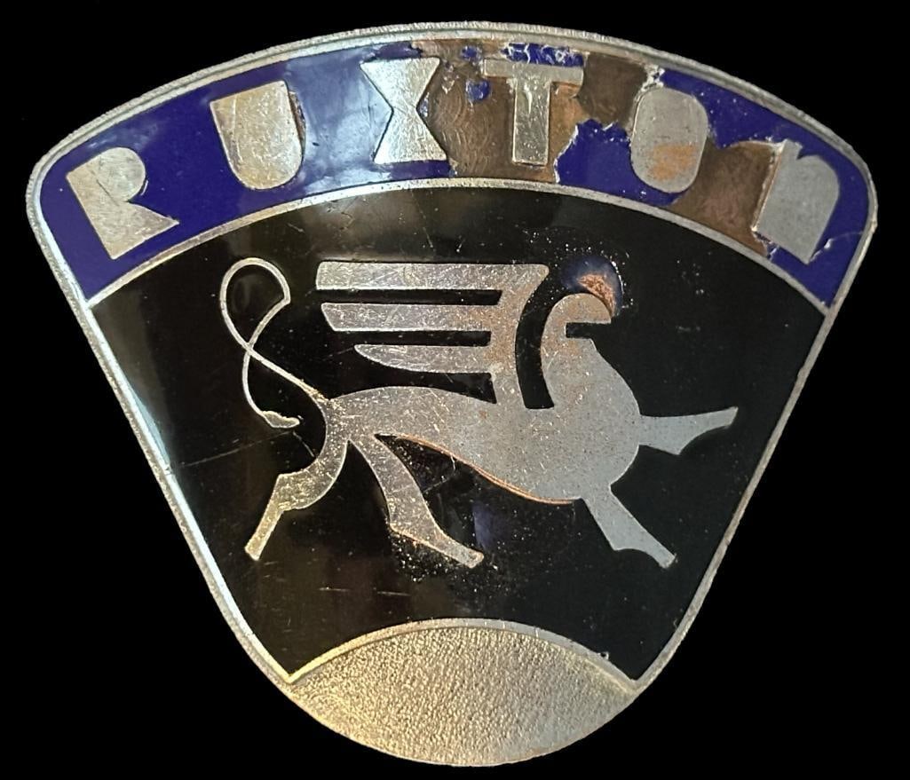 Ruxton Radiator Emblem: 1929 - 1930 Ruxton radiator emblem. This is a original Ruxton radiator emblem that was used on one of the few Ruxton cars made. It has the proper front design details and proper mounting device. The