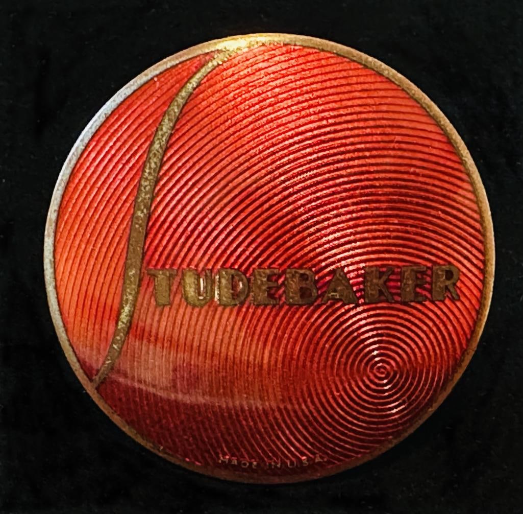 Studebaker Radiator Emblem: 1936 - 1938 Studebaker radiator emblem. This emblem has a DL Auld makers mark and measures approximately 2.75" in diameter.