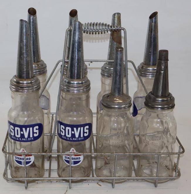 Group of 8 Standard Iso-Vis 1 Quart Bulk Oil Bottles with Carrying Rack: 17.5" x 9" x 16" - 6 bottles are Iso-Vis, 2 bottles are marked Moore & Kling Inc