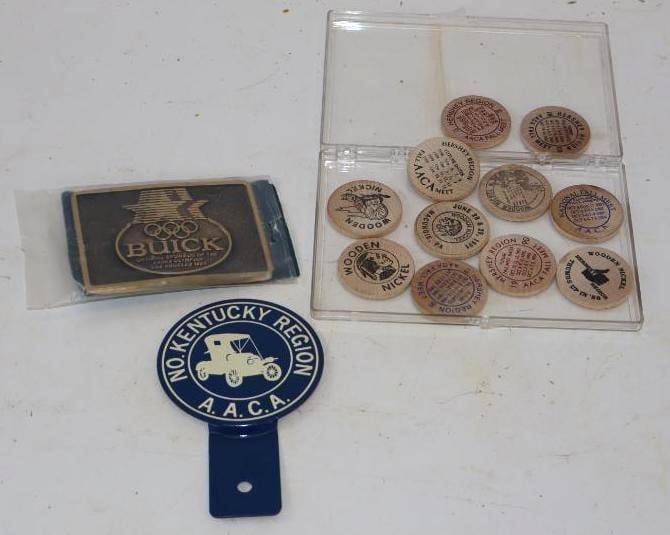Group of 13 Buick Belt Buckle, AACA License Plate Topper, and 11 Hershey Swap Meet Wooden Nickles: Largest is 3" x 4.75"