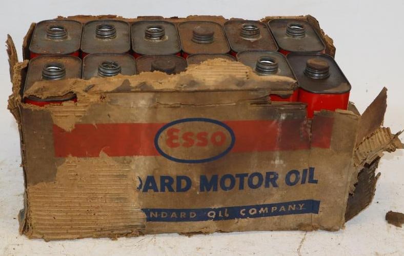 Group of 12 Esso Outboard Metal One Quart Oil Cans with Original Box: 8 cans are missing caps. Box is in poor condition. 4.5" x 2.25" x 7.5" each. Box measures 15" x 9.5" x 7"