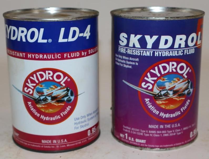 Group of 2 Skydrol LD-4 and LD-5 Aviation Hydraulic Fluid One Quart Metal Oil Cans: Empty. 32oz each