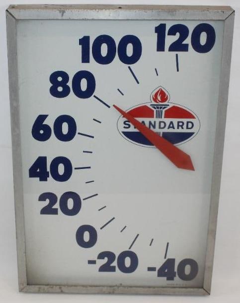 Standard Oil Company Advertising Thermometer: This thermometer is in working condition. It has an aluminum frame and a glass face. There is some oxidation on the aluminum frame. The painted dial is in very good condition with only minor wear. Thi
