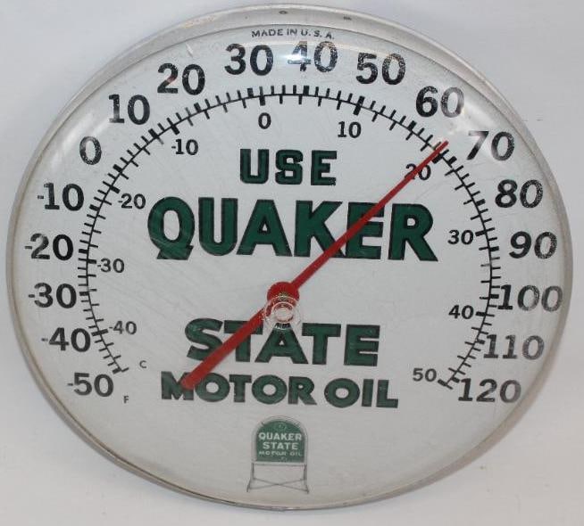 Use Quaker State Motor Oil Advertising Thermometer: This thermometer has a plastic face. It is in working condition. The outer plastic has some light surface scuffs and wear. It measures 12" x 12" x 2" and is graded an 8.5.