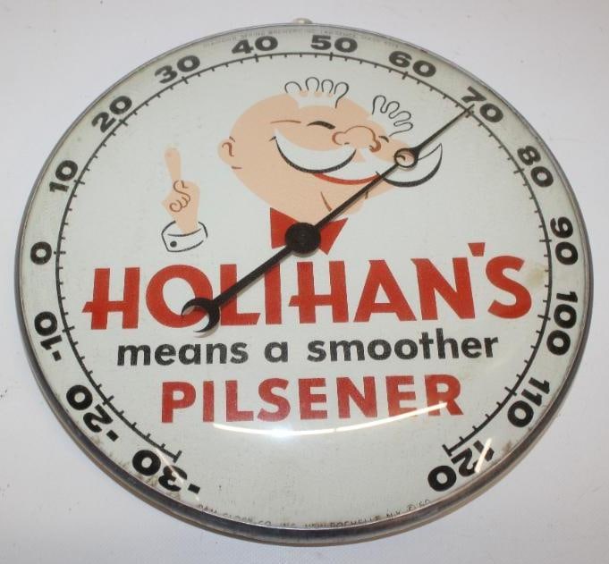 Holihan's Means a Smoother Pilsner Advertising Thermometer: This thermometer is marked PAM Clock Co. '60. It has a glass face and works as it should. It is in very good overall condition with slight staining along the lower edge. This thermometer measures 12"