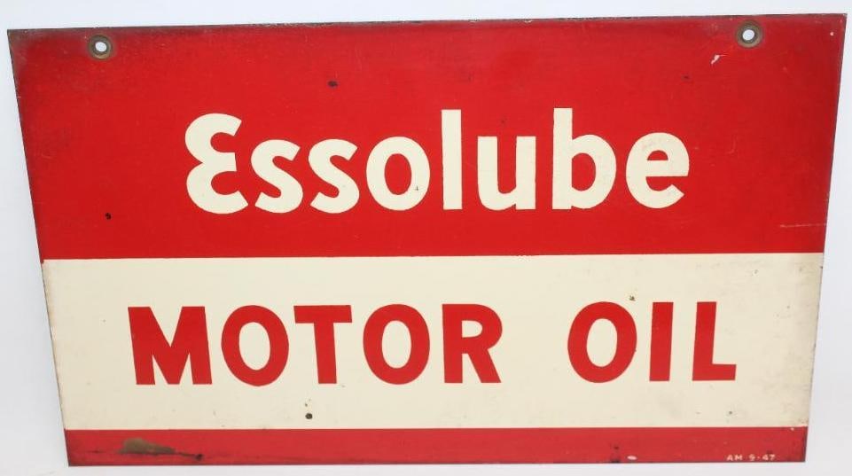 Essolube Motor Oil DST Oil Can Rack Sign: This sign is marked AM 9-47. The display side is in good condition with some staining and discoloration around the perimeter. The reverse side is also nice but has some minor stable bubbling to the pa