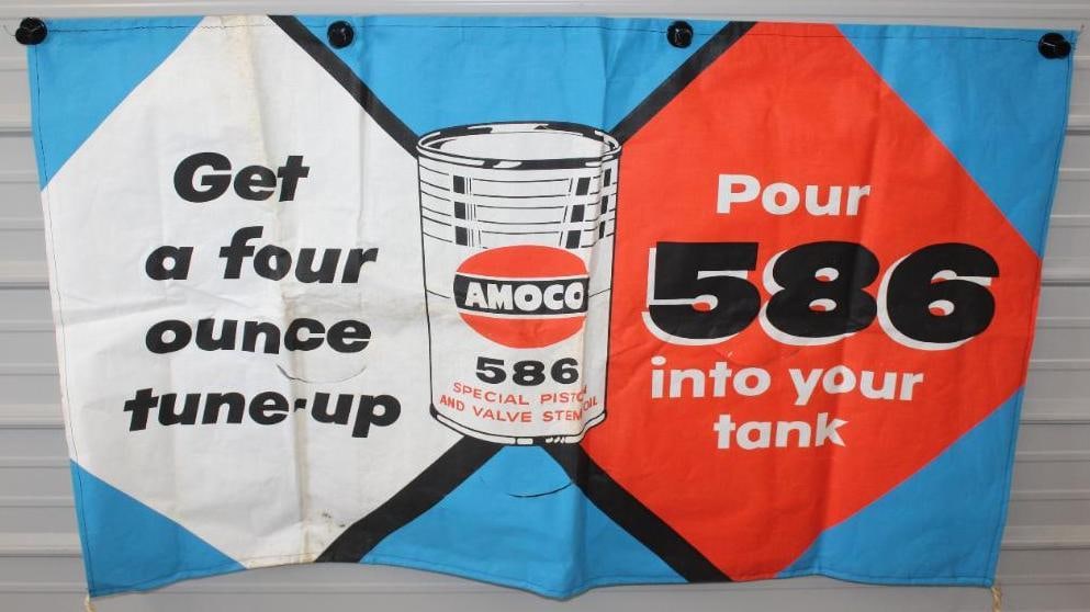 Amoco 586 Piston and Valve Oil Advertising Canvas Banner: This banner has some areas of staining and discoloration. There are also some folds that may improve. This banner measures 33" x 56" and is graded an 8.