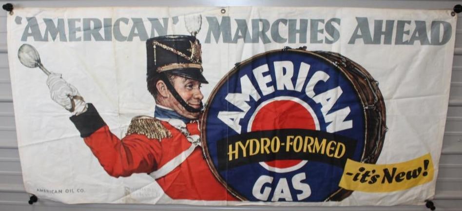 American Oil Marches Ahead Norman Rockwell Canvas Advertising Banner: This banner has some slight staining throughout. There are some folds that could improve. This banner measures 76" x 36" and is graded an 8.