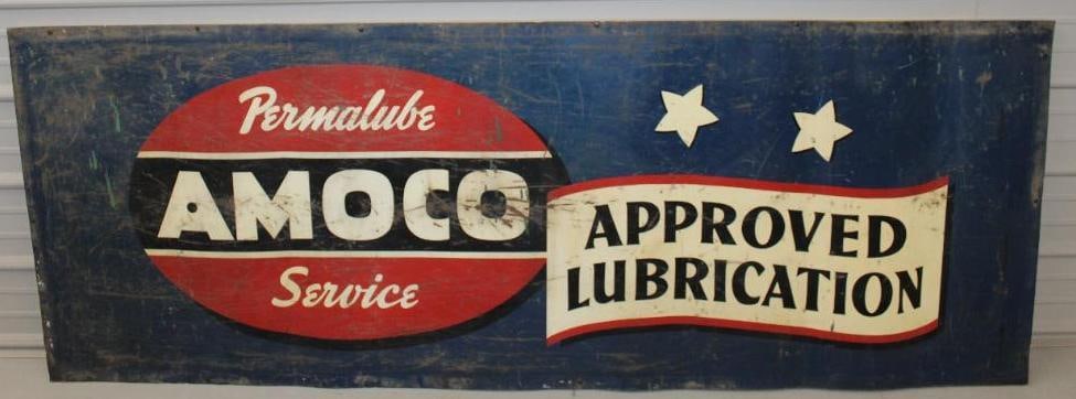 Amoco Approved Lubrication SST Billboard Sign: This is a large single sided tin Amoco sign. It has areas of heavy scratching and wear throughout the entire field. It also shows rust staining throughout. The sign is attached to a wood frame. Overal