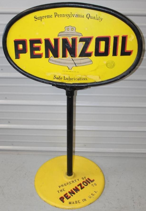 Pennzoil Safe Lubrication DSP Porcelain Curb Sign with Base: The display side of this sign shows some color match throughout the field. The reverse side has several chips throughout. It does have the original ring and base. The overall measurement is 50" x 31"