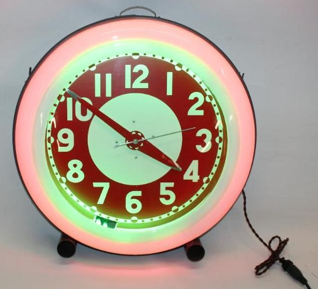 1930's Red and Green Neon Cleveland Clock: This clock has been fully restored. Both lines of neon light up and the clock keeps time. This clock measures 28" x 28" x 8.75"