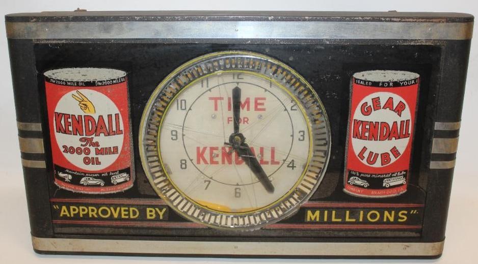 Kendall Motor Oil Neon Advertising Spinner Clock: This is a very unique spinner clock with Kendall oil and gear lube can graphics. It does light up and keep time. The spinner mechanism also works and rotates. The reverse painted glass display shows s