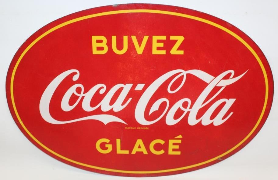 Drink Iced Coca-Cola SST Advertising Sign: This is the French version of this sign. There is some discoloration to the field with some surface scratches. This sign measures 34.75" x 23.75" and is graded an 8.25.