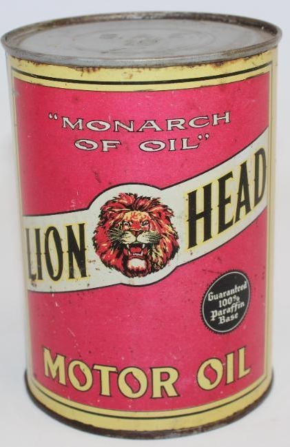 Gilmore Lion Head Metal One Quart Oil Can: This oil can has been drained by two small holes in the bottom lid. This is a solder seam can. The display and reverse side both have some minor surface scratches and light rust staining. There is als