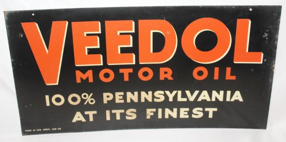 Veedol Motor Oil 100% Pennsylvania DST Sign: The display side of this sign has good color with some minor rust staining and wear along the perimeter. The reverse side shows areas of discoloration as well as heavier rust staining along the perime