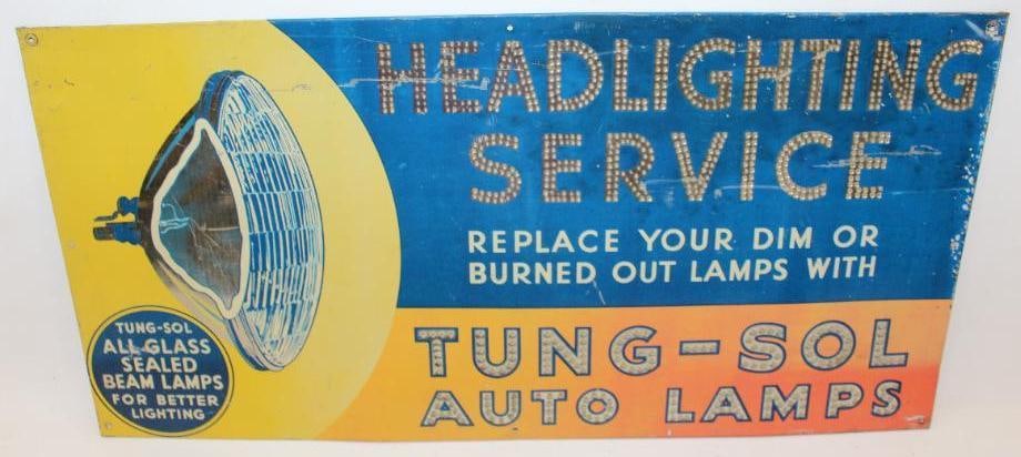 Tung-Sol Auto Lamps SST Advertising Sign: This embossed tin sign is marked The Donaldson Art Sign Co. It has some discoloration throughout along with some surface wear and scratches to the field. This sign measures 23" x 11.5" and is graded 7