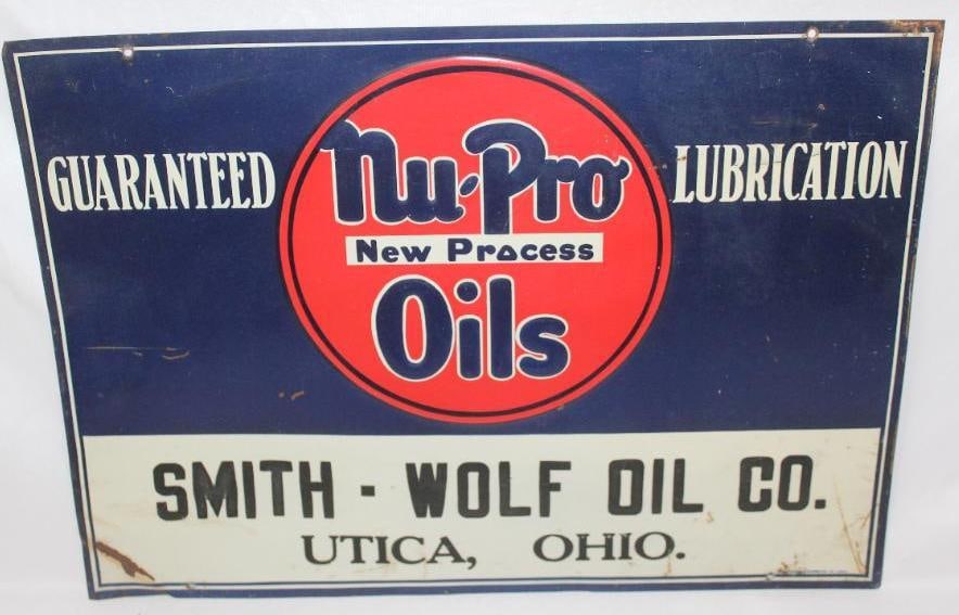 Nu-Pro Oils Smith Wolf Oil Co. Embossed SST Sign: This sign shows good color and gloss throughout. It does have some areas of rust staining along the edges, and a crease near the lower left corner. This sign measures 14" x 19" and is graded an 8.