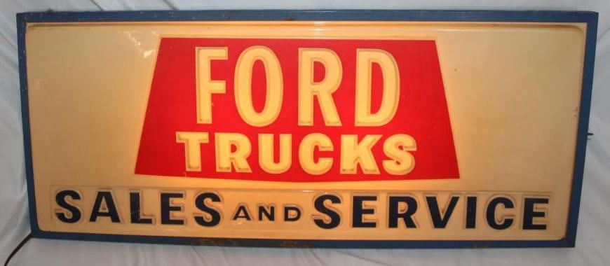 1950's Ford Trucks Sales and Service Light Up Advertising Sign: This sign has the original Somerville Displays label on the can. The sign is in working condition. The can also retains its original blue paint. It has a formed plastic front face which shows some sli