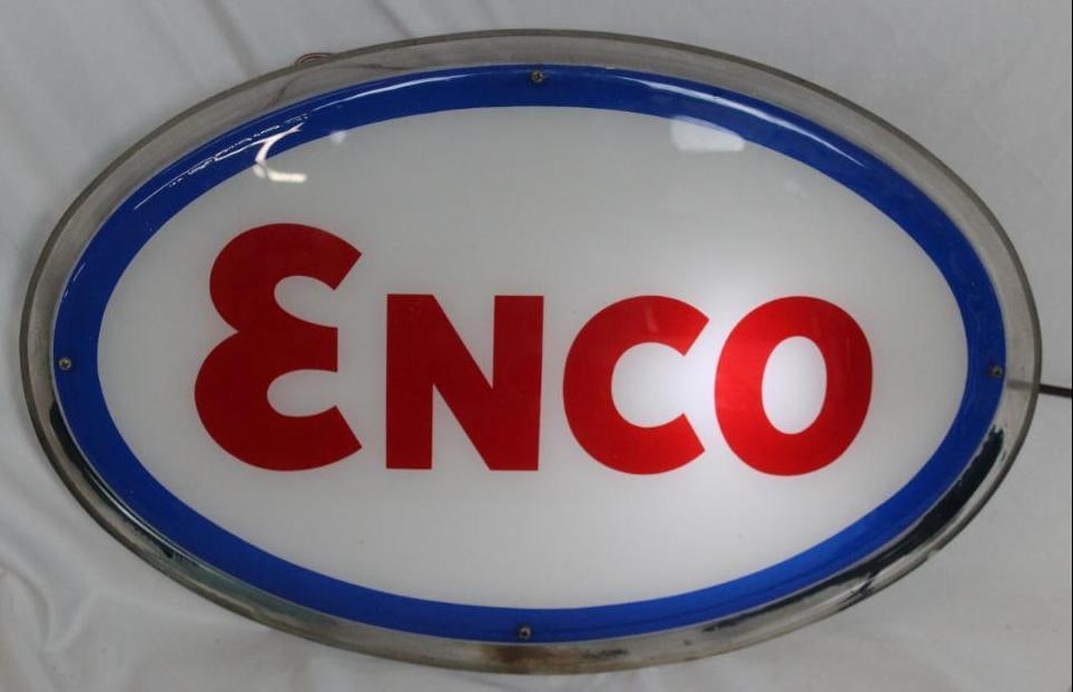 Enco Light Up Advertising Sign: The display side of this sign is in good overall condition with some scuffs to the surface of the field. It is in working condition. The back of this sign shows a hole that was created by an overheate