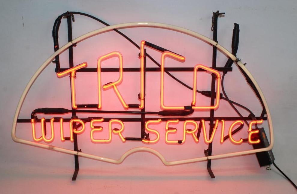 Trico Wiper Service Neon Advertising Sign: This sign lights up and works. It is in very good overall condition. This sign measures 34" x 22" x 4"