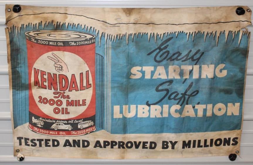 Kendall Motor Oil Canvas Advertising Banner: This banner has a makers mark of MCA Sign Co. It does show some discoloration and staining throughout. There are also a few small tears to the canvas. This banner measures 29" x 44" and is graded a 7.