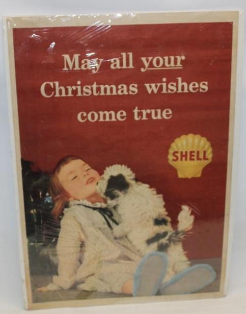 Shell Oil Company Advertising Poster: This poster is marked December 1960. It is made out of a heavy paper material. It shows some slight discoloration throughout. It is currently wrapped in plastic on a foam board. The poster measures 38