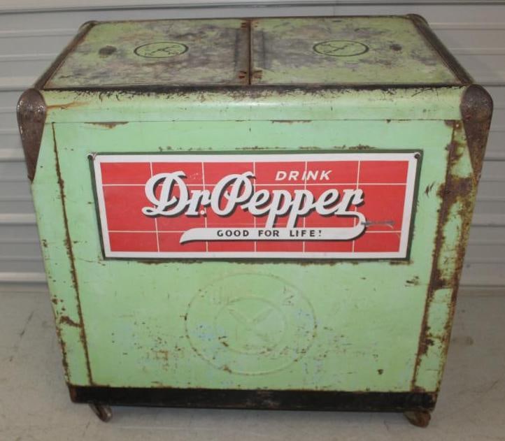 Dr. Pepper 10-2-4 Embossed Soda Cooler: This cooler has a reproduction Dr. Pepper sign mounted to the front. It appears to have original paint throughout with some rust staining and wear. It is missing the hinges on the top, but comes with