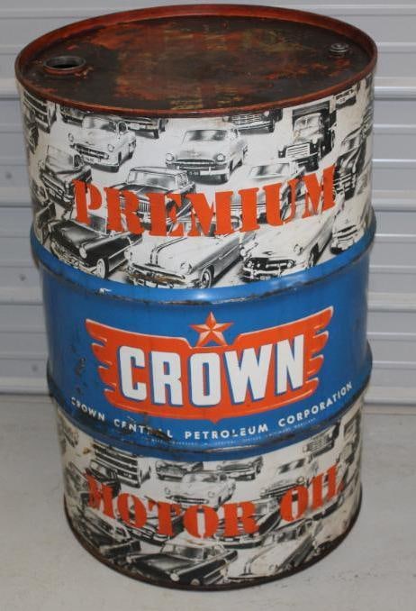 Crown Central Petroleum Corporation 55 Gallon Motor Oil Barrel with Automobile Graphics: This oil barrel shows scratches and surface wear throughout, but is in overall good condition. This oil barrel measures 23" x 23" x 35"