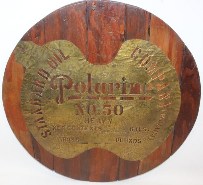Standard Oil Polarine Brass Oil Barrel Stencil: This stencil is mounted to a wooden display. It measures 21" x 21" x 0.75.