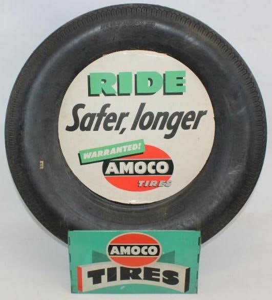 Amoco Advertising Complete Tire Display Rack: This is an original hinged type tire display with an Amoco tire, and cardboard advertising tire insert sign. The display and insert both show some minor wear to the field. The overall measurements are