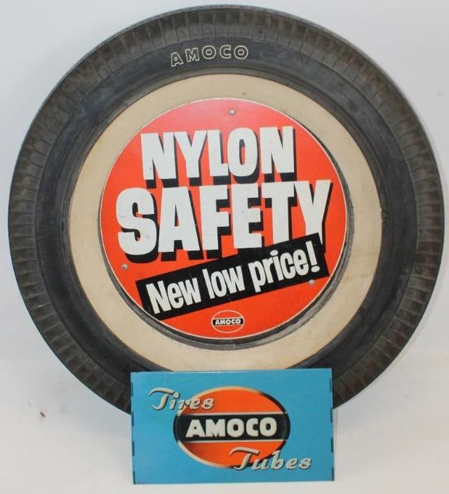 Amoco Advertising Complete Tire Display Rack: This is an original hinged type tire display with an Amoco tire, and metal advertising tire insert sign. The display and insert both show some minor wear to the field. The overall measurements are 29"