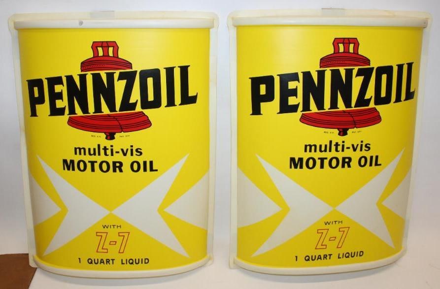 Group of 2 NOS Pennzoil Oil Can Shaped Plastic Advertising Display Signs in Original Box: Both signs have small cracks along the outer edge. The signs measure 17.25" x 22.75" x 3.25" and the box measures 18" x 6.5" x 23". They are both graded a 9.