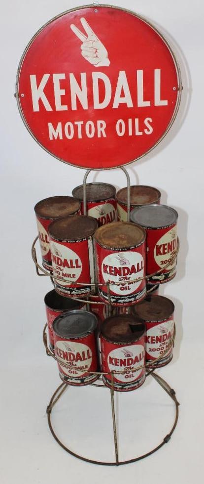 Kendall Motor Oils Display Rack with Twelve Kendall One Quart Metal Oil Cans: All of the metal oil cans on this display rack are empty. Some cans are missing their top lids, and others are missing their bottom lids. The rack sign is double sided metal. It is in good condition w