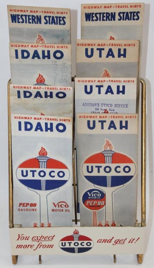 Utoco Utah Oil Company Map Rack Display: This display rack has a single sided metal sign. It also includes 8 Utoco maps. The display sign is in excellent condition with only minor discoloration around the edge. The overall measurements are 9