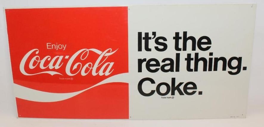 Enjoy Coca-Cola "It's The Real Thing" Advertising SST Sign: This sign is marked MCA 765. It is in excellent overall condition. This sign measures 30" x 15" and is graded a 9.