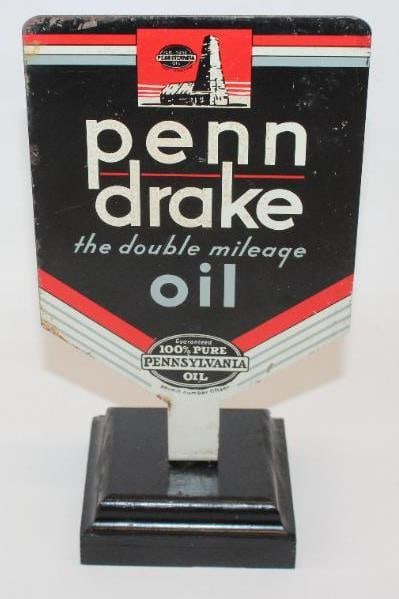Penn Drake Painted Metal Advertising Paddle Sign: This paddle sign is mounted to a wooden base. The sign displays very well with only light staining and surface wear. The overall measurements are 5" x 3.5" x 8.5" and is graded an 8.5 on the display s